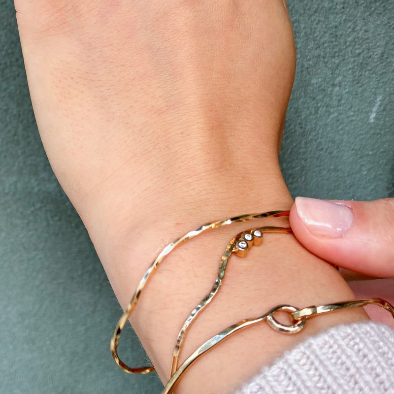 Twisted armbånd i 14 karat guld