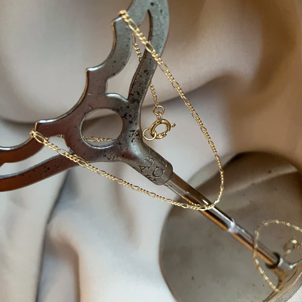 Figaro armbånd i 18 karat guld