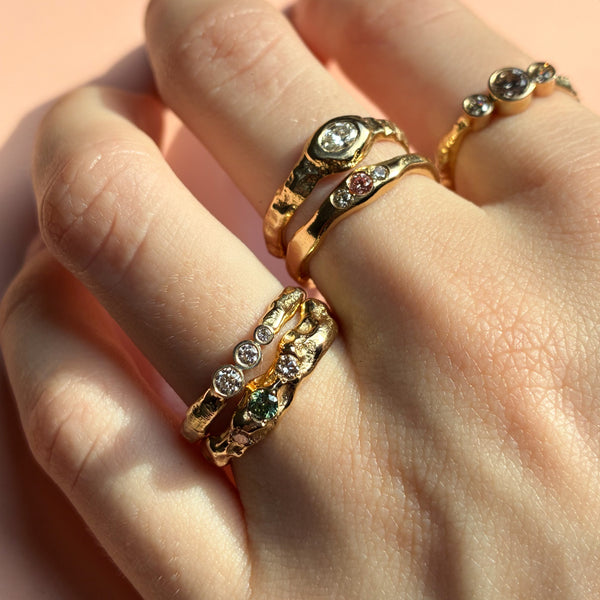 Merkur trestensring i 14 karat guld med 0,10 ct tw/vs diamanter